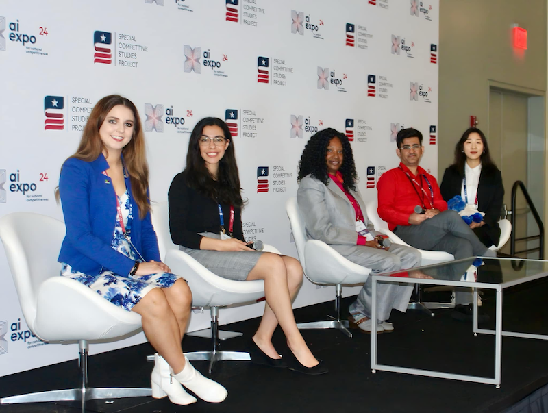 four NASA scientists and educators sit on a panel at the AI Expo